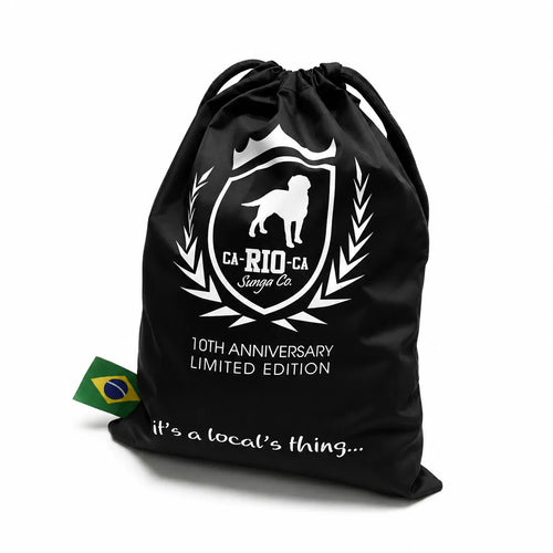 Black drawstring bag with a large white animal crest and lettering.