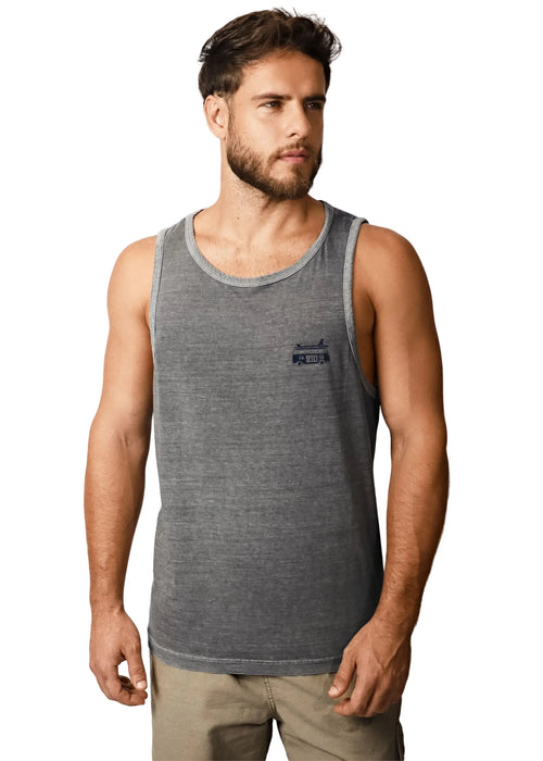 Man wearing a gray tank top and tan trousers.