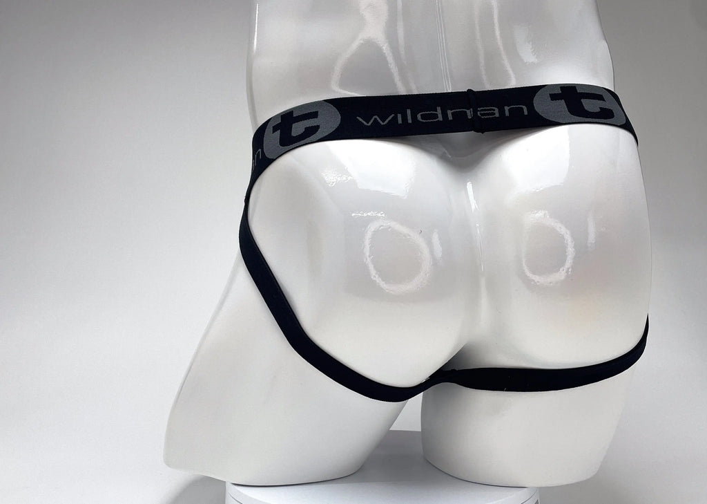 White mannequin rear wearing black underwear with a gray logo waistband.
