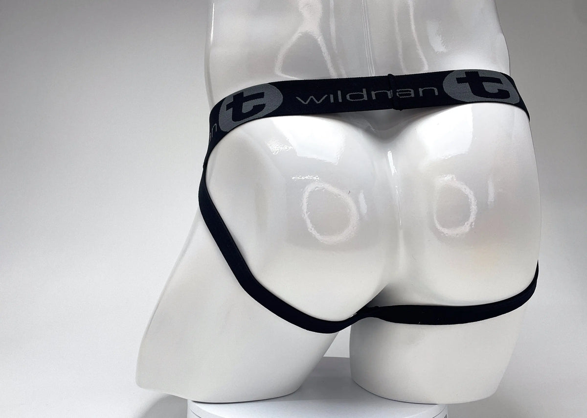 White mannequin rear wearing black underwear with a gray logo waistband.
