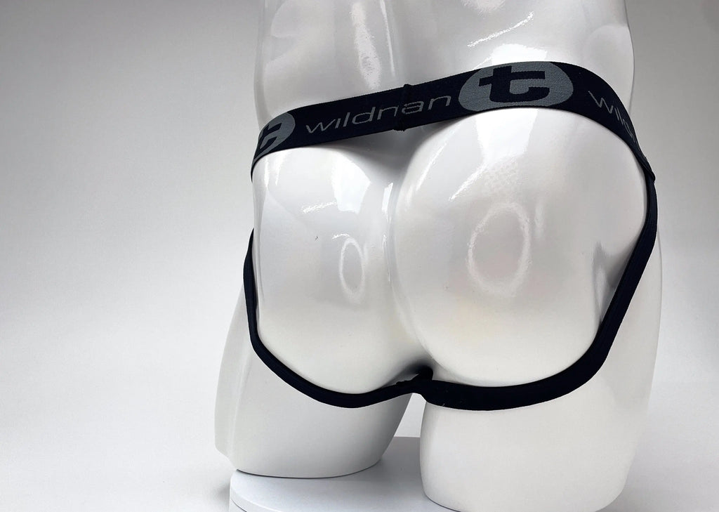 White mannequin rear wearing black underwear with gray logo text.