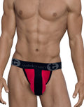 Torso of a person wearing red and black underwear with a black waistband.