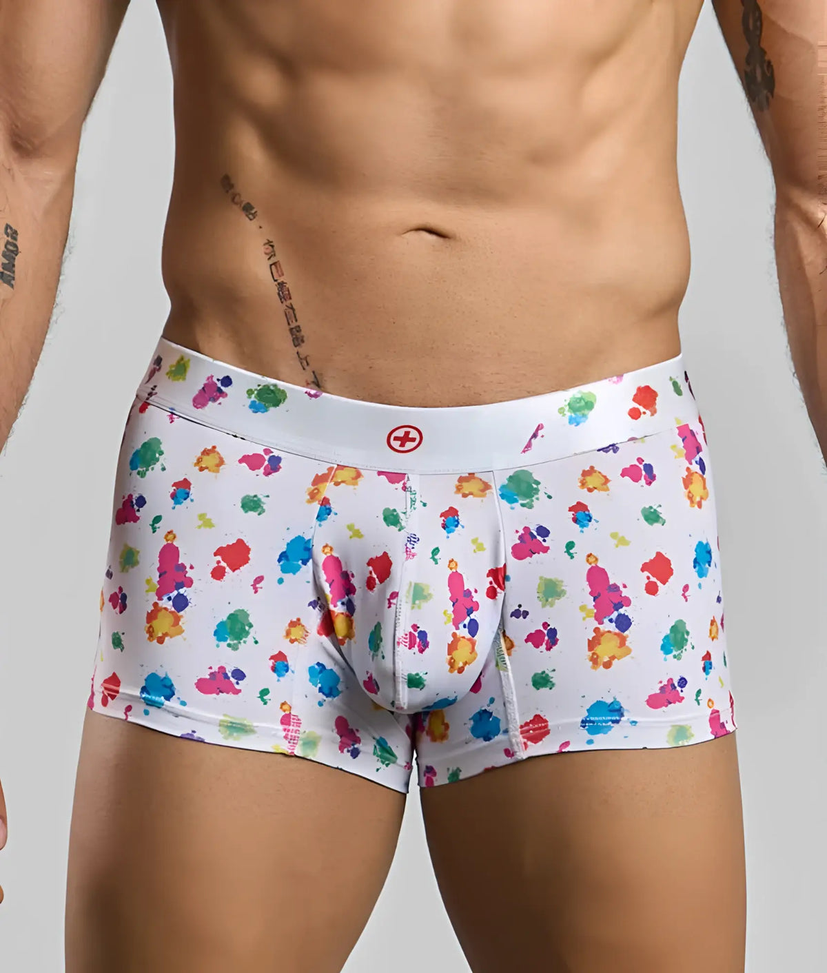 Malebasics trunk hipster white splash boxer briefs with vibrant multicolored paint splatter and red cross waistband