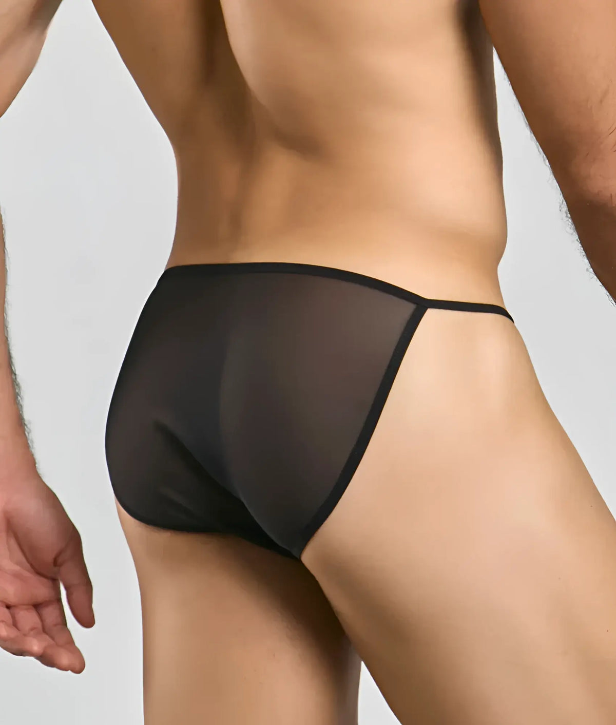 MOB menâ€™s sheer bikini black sheer mesh briefs with a sleek minimalist design visible from the front side