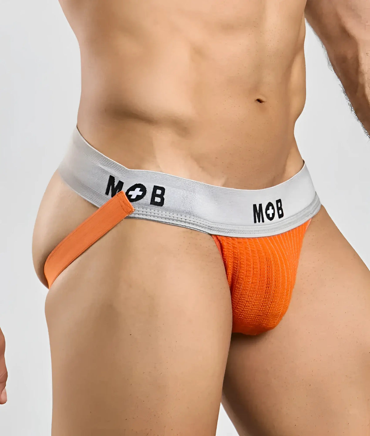 Orange knitted briefs with gray waistband and mob logo in black lettering from mob classic jock 3 inches collection