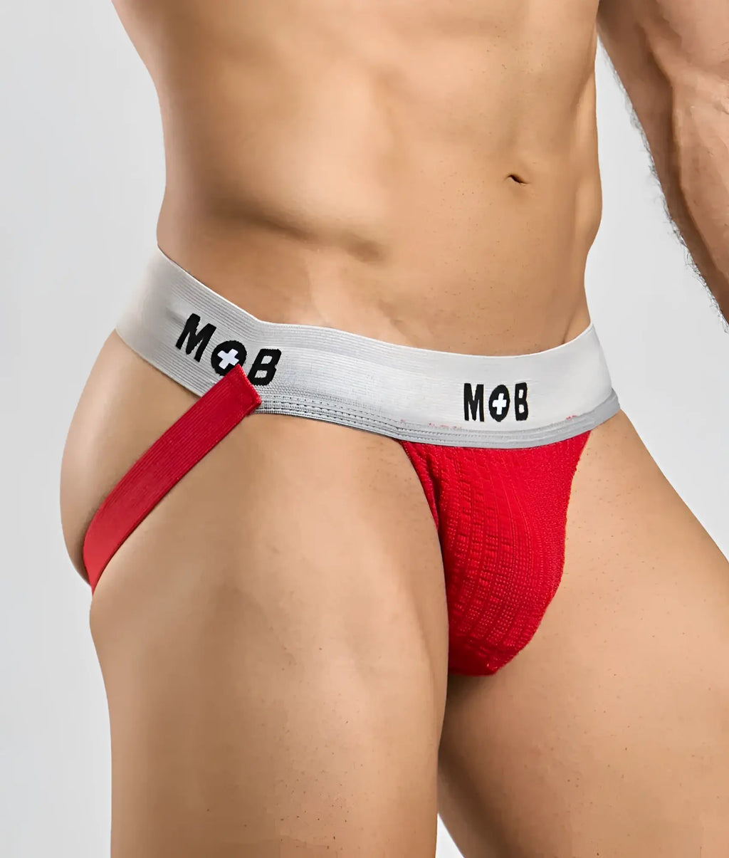 Red textured briefs with a gray waistband featuring the mob logo in black from the mob classic jock 3 inches line