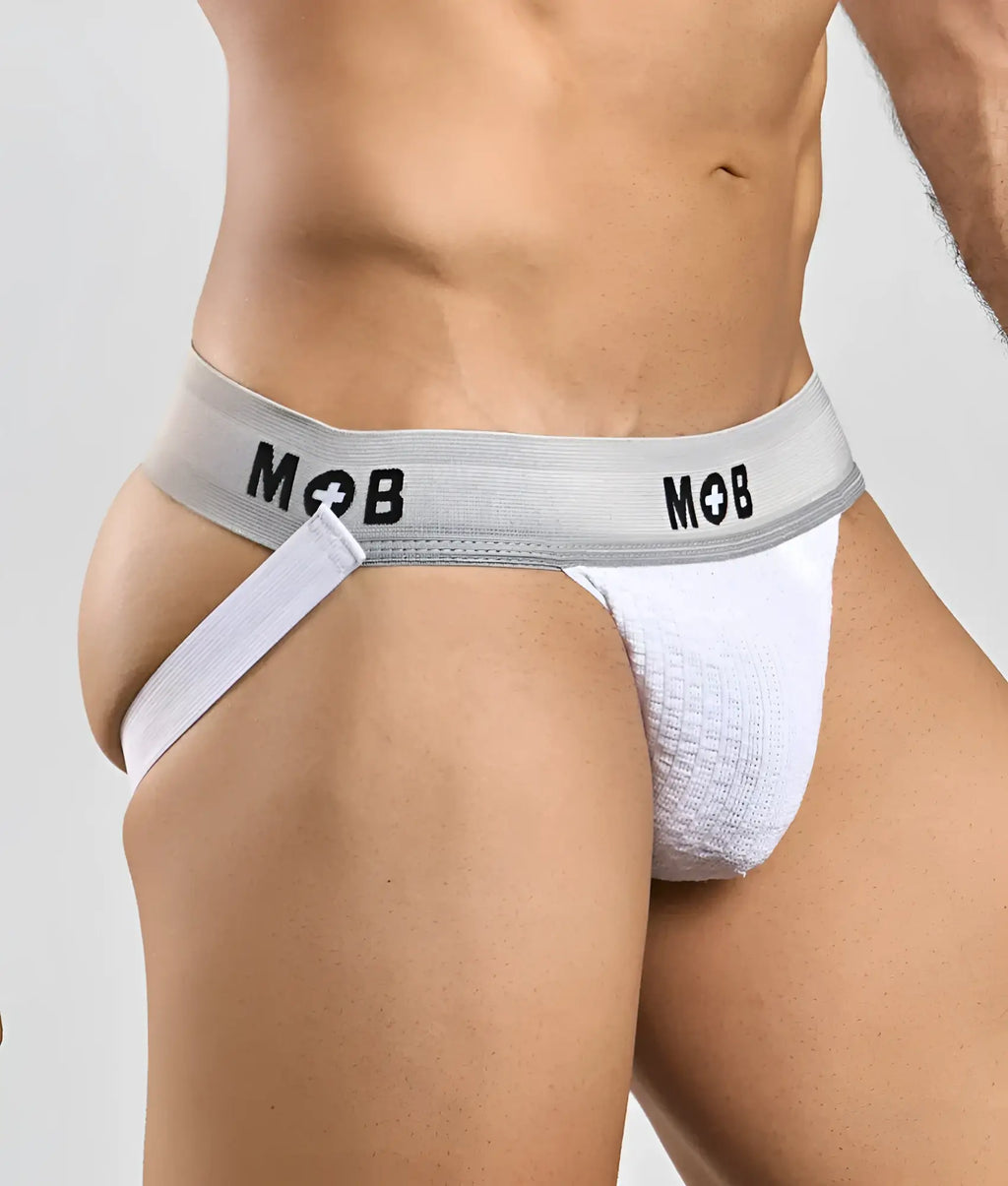 White textured jockstrap with gray elastic waistband and black mob branding from the mob classic jock 3 inches collection