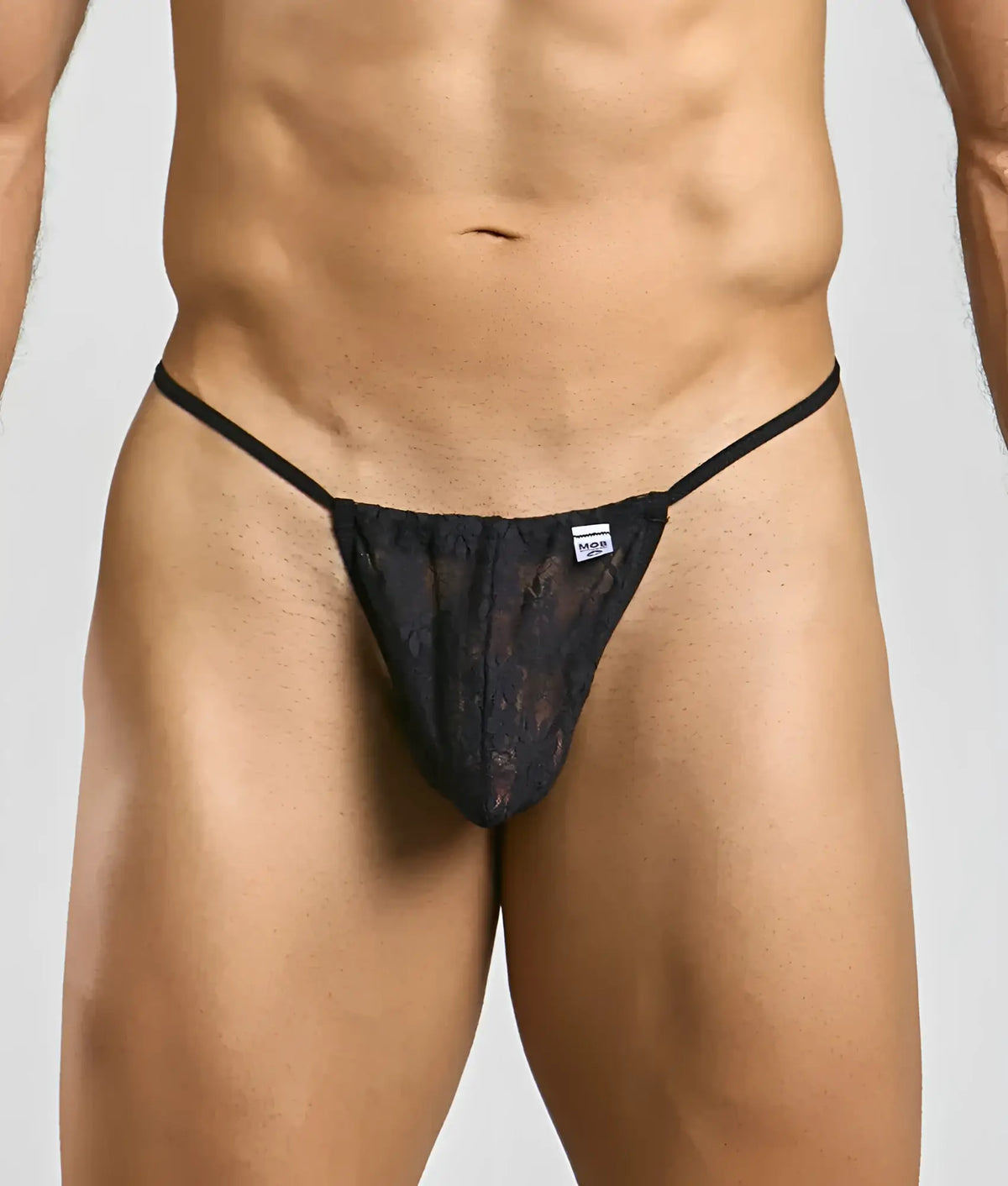 Black lace thong g-string with thin straps and a small brand tag at the waistband in mob print design