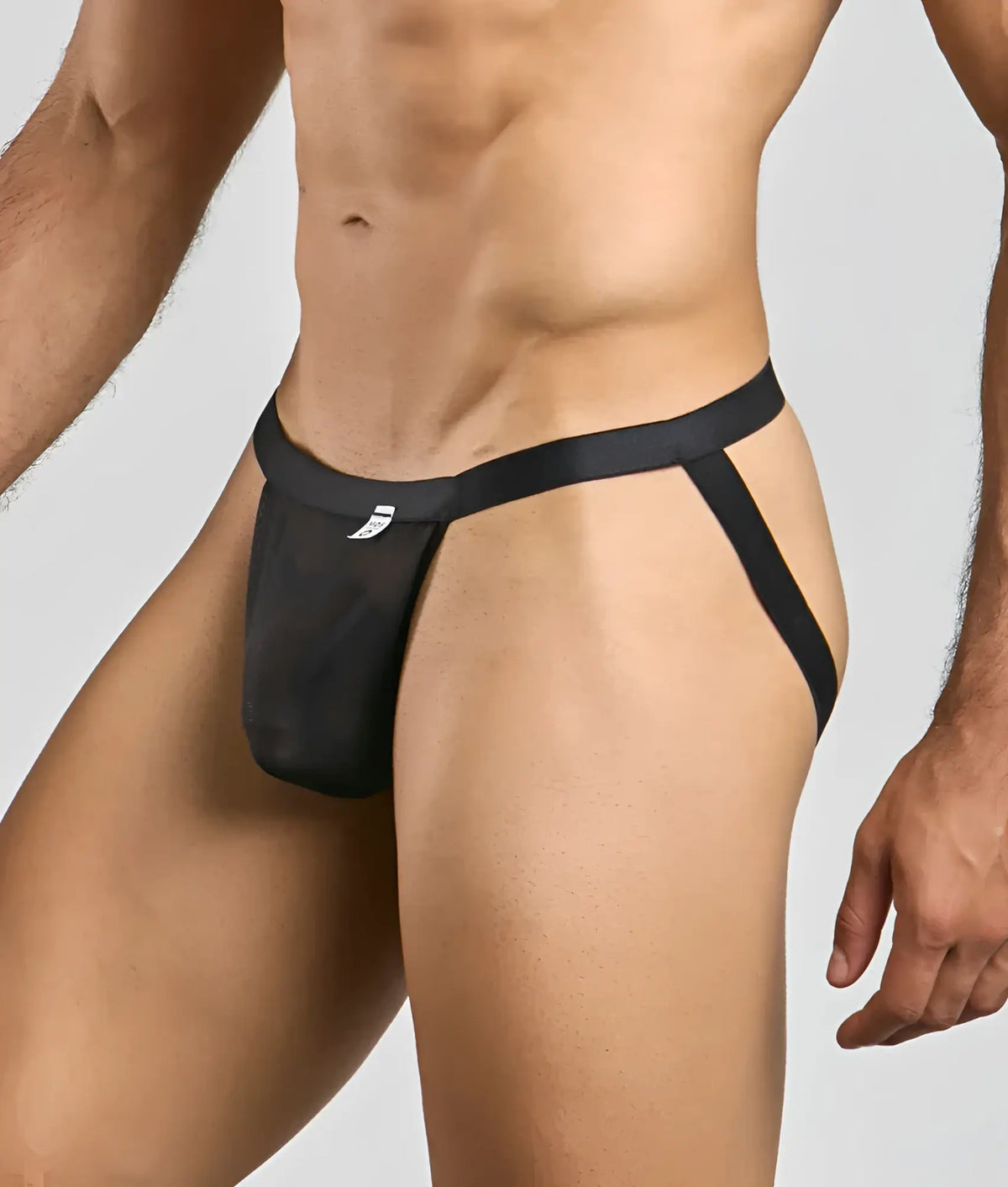 Black mesh briefs with a sleek minimalist design and small white logo on the waistband from MOB sexy mesh and lace jockstrap