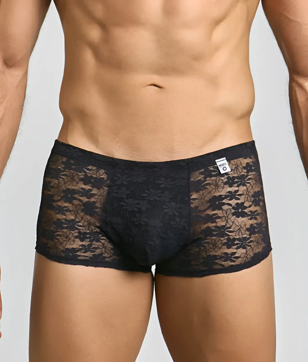 Menâ€™s black mesh lace pouch trunk briefs featuring floral lace and a solid fabric panel in front
