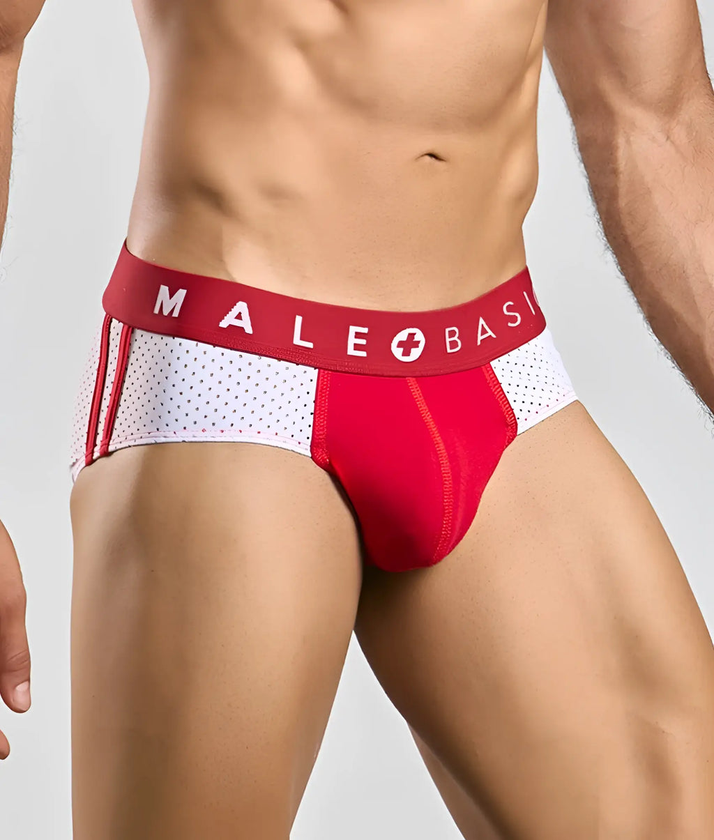 Red and white male basics spot brief with perforated side panel and bold brand name on the waistband