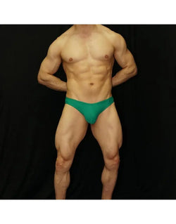 Green bikini swimsuit by Arroyman featuring a snug fit and minimal coverage shown on a model against a black background.
