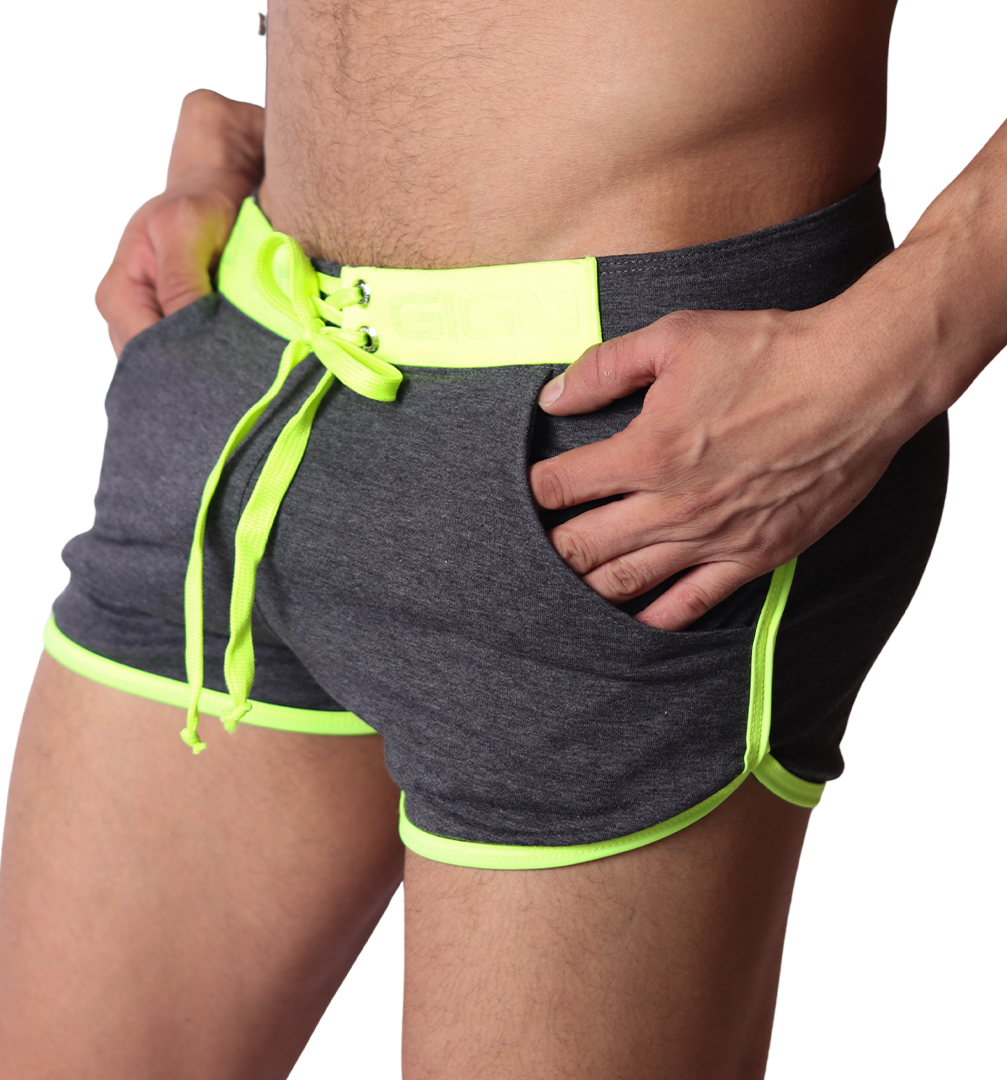 Side view of Gigo Nafts gray jersey shorts with neon yellow trim, lace-up waistband, and drawstring.