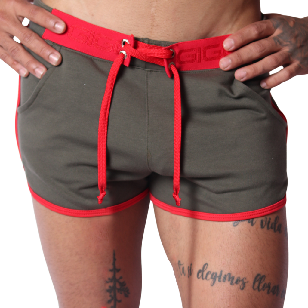 Front view of Gigo Nafts green jersey shorts with red trim, lace-up waistband, and drawstring detail.
