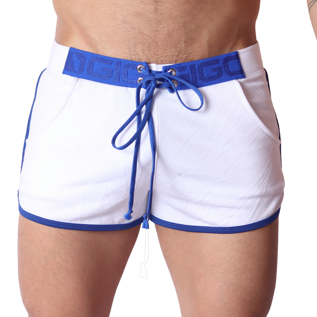 Front view of Gigo Nafts white jersey shorts with blue contrast trim, logo waistband, and lace-up drawstring closure.