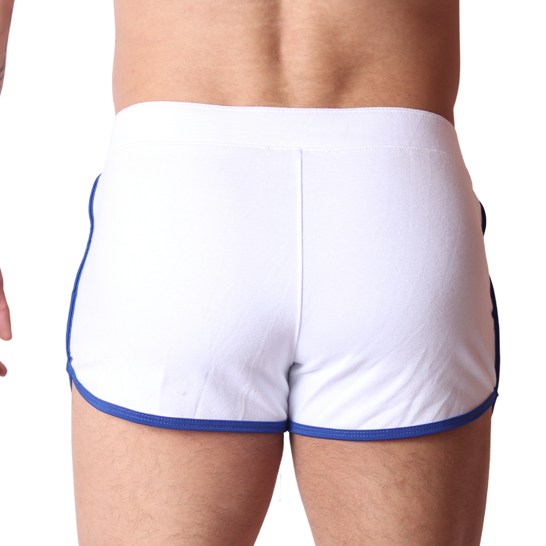 Back view of Gigo Nafts white cotton shorts with blue trim and elastic waistband.