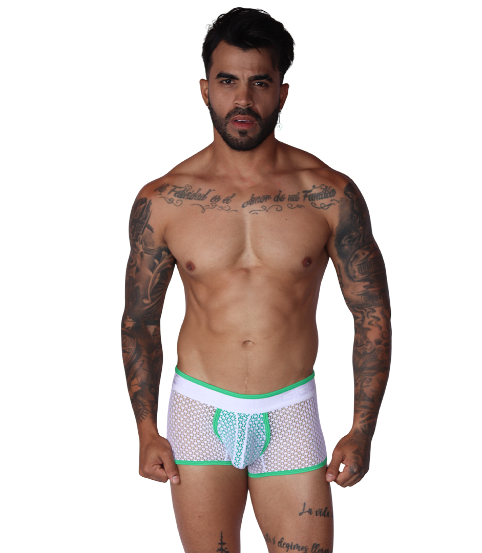 Front view of Gigo green and white net fabric trunk underwear with elastic logo waistband on a tattooed model.
