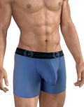 Torso of a person wearing blue boxer briefs with a black waistband.