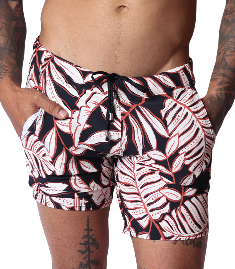 Front view of Gigo Prisma black beachwear shorts with red and white leaf print and adjustable drawstring waist.