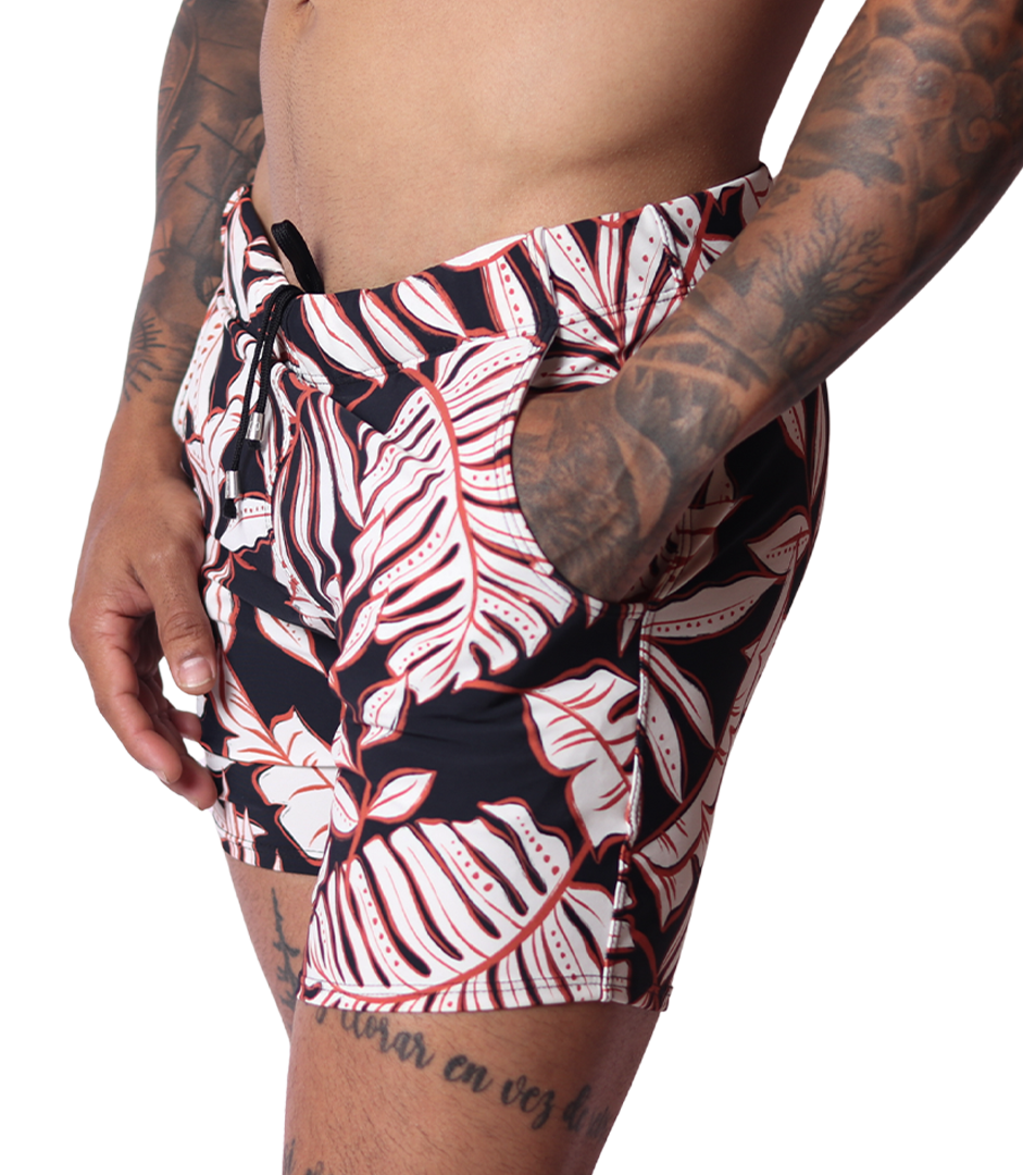 Gigo Prisma black and white leaf print beachwear shorts, side view showing drawstring waist and pocket detail.