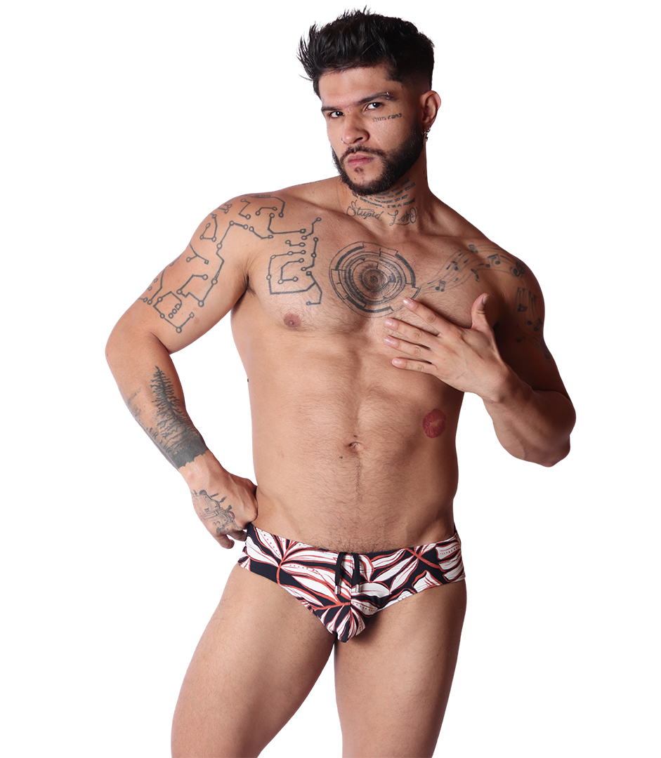 Front view of Gigo Prisma black swim brief featuring a white and orange leaf print pattern on fabric.