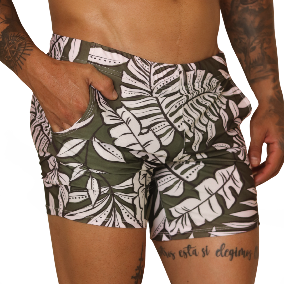 Front view of Gigo Prisma green leaf print beachwear shorts with side pockets in soft stretch fabric.