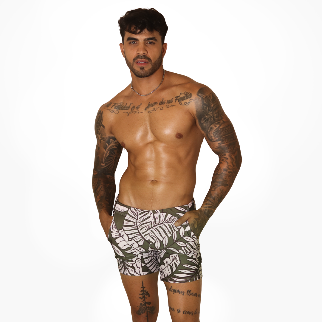 Front view of Gigo Prisma green beachwear shorts with a white leaf print, featuring a stylish, lightweight fabric.