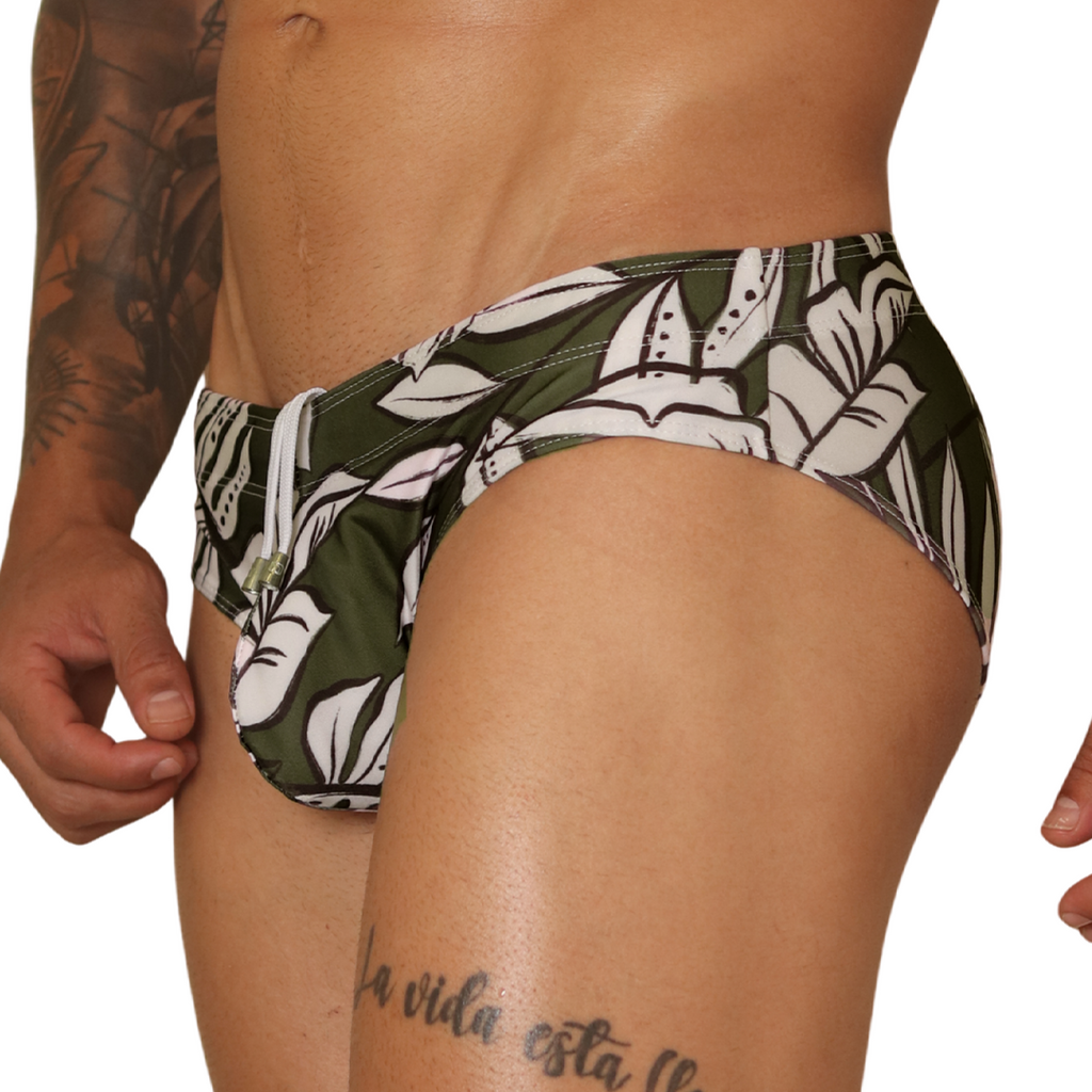 Side view of Gigo Prisma green leaf print swim brief with white drawstring in smooth, stretch-fit fabric.