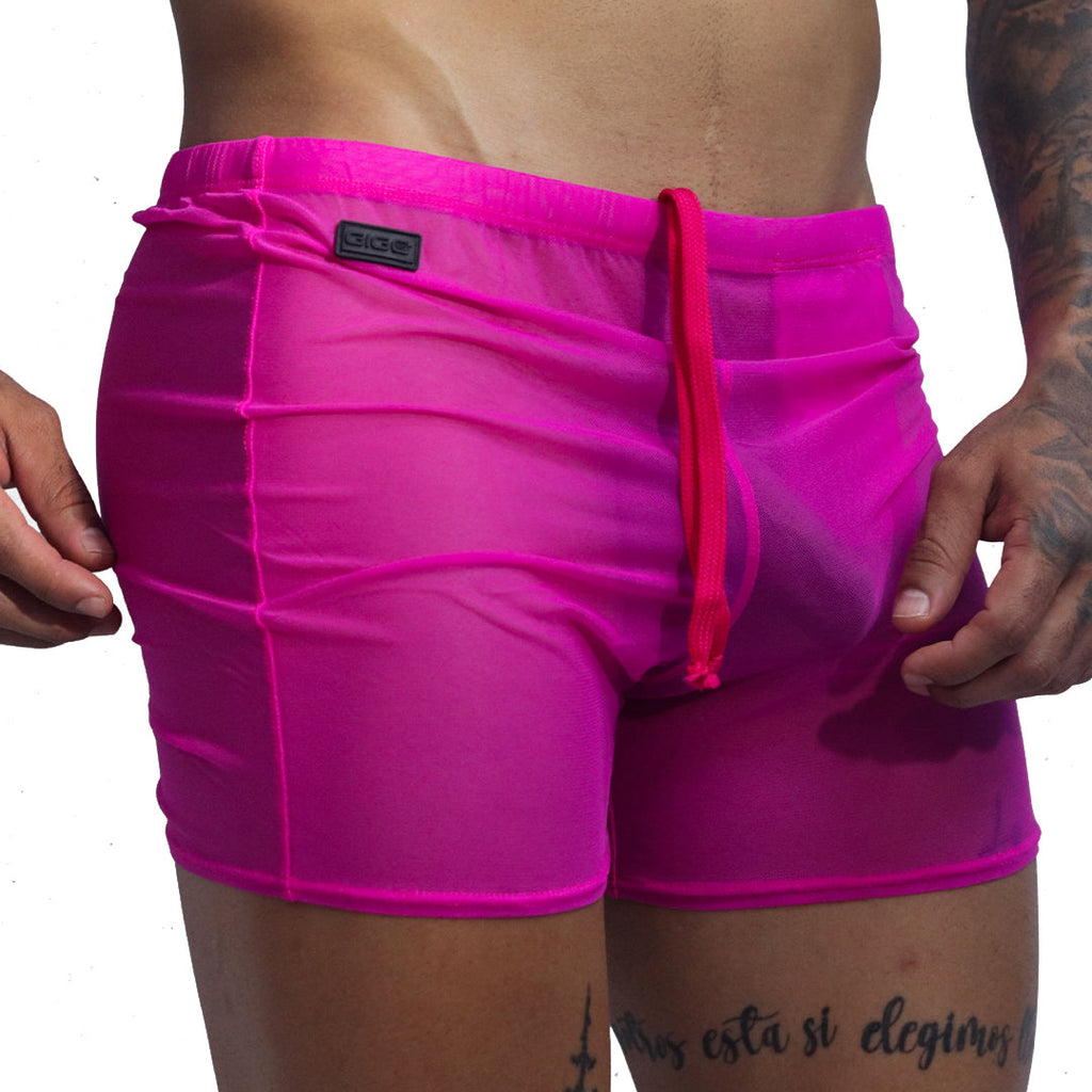 Front view of Gigo Spectrum fuchsia sheer mesh hot shorts with drawstring and black logo tag.