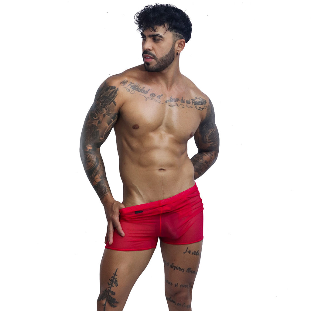 Front view of Gigo Spectrum red sheer mesh hotshort underwear on a tattooed male model.