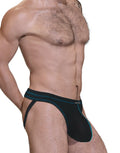 Side view of a person wearing black underwear with blue stitching on a white background.