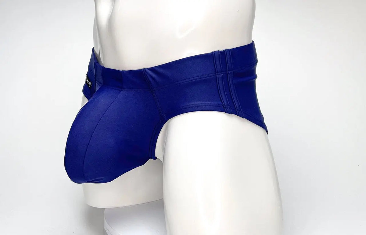 Blue briefs with a pouch on a white mannequin against a plain background.