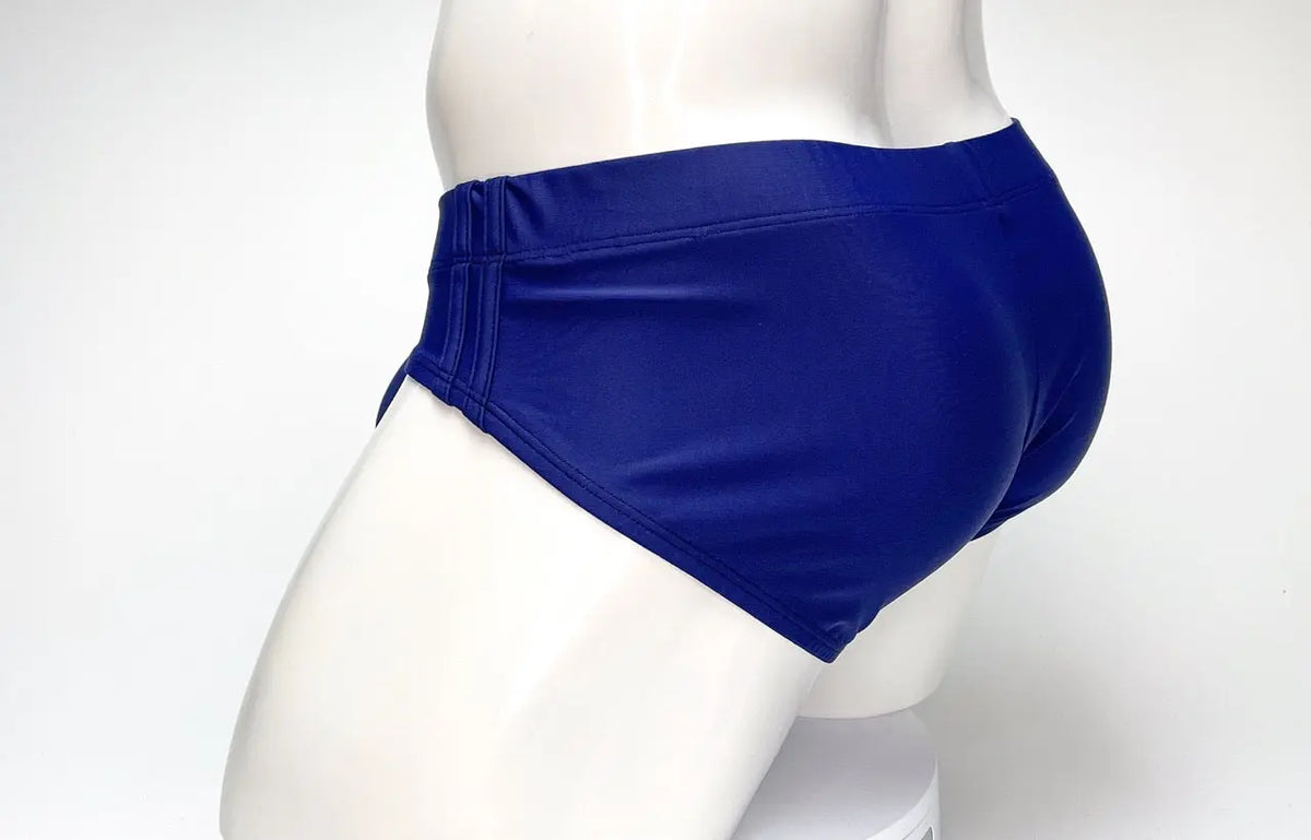 Blue briefs on a white mannequin against a white background.