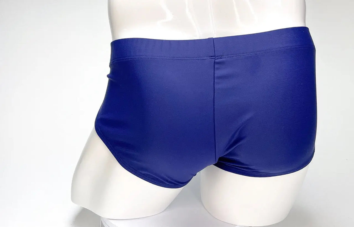 Blue briefs on a white mannequin, rear view.