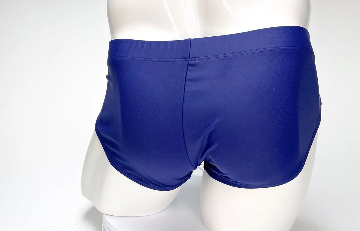 Blue shorts on a white mannequin, rear view against a plain background.