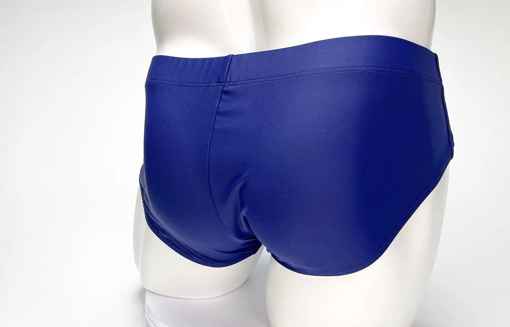 Blue briefs on a white mannequin against a white background.
