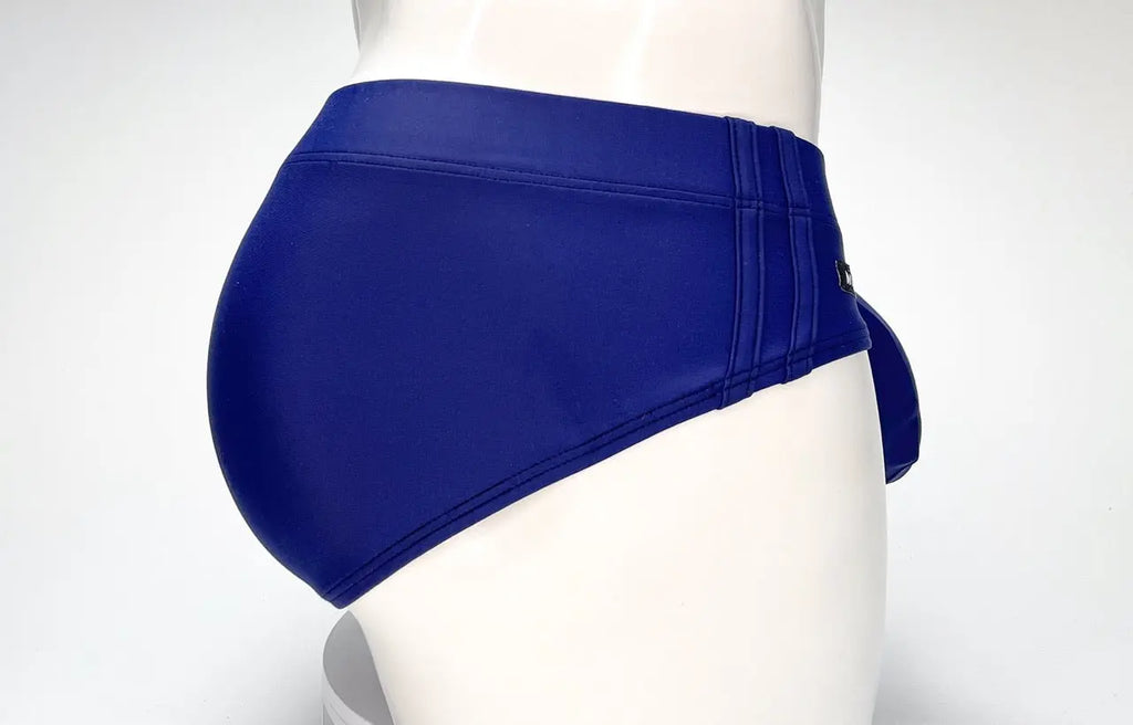 Blue high-waisted briefs with side straps on a white mannequin.