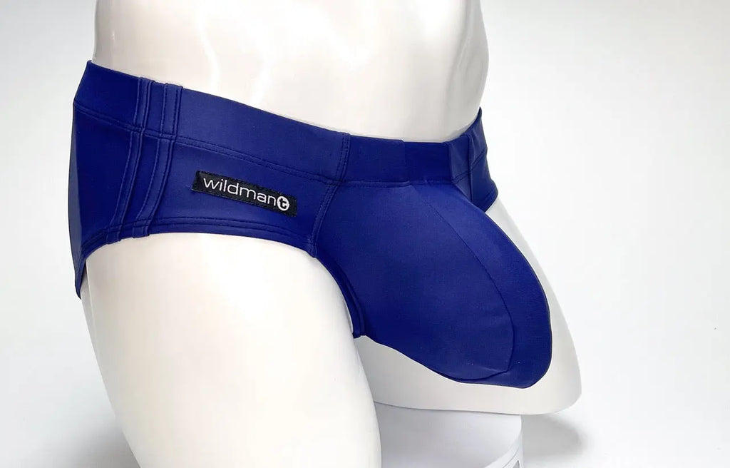 Blue briefs with a black label on a white mannequin against a white background.
