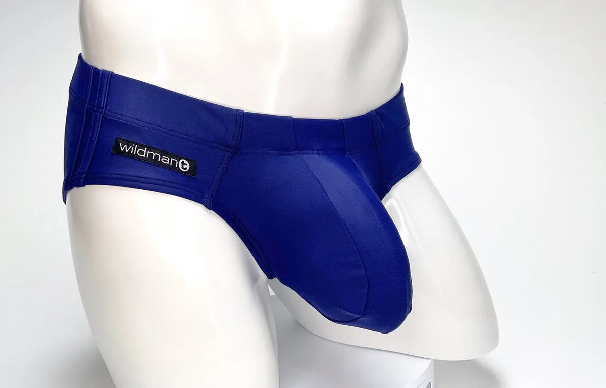 Blue briefs with a black label on a white mannequin.