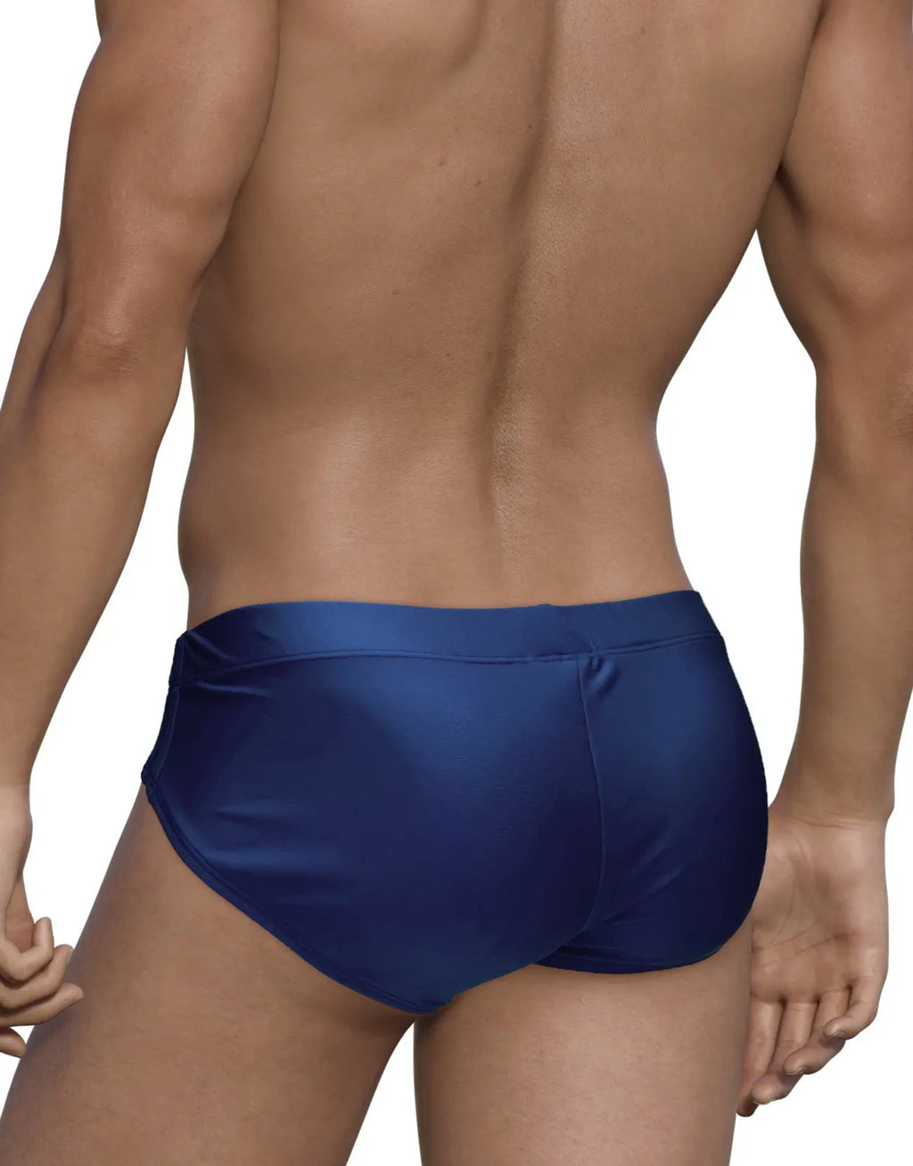 Rear view of a person wearing dark blue brief-style swimwear against a white background.
