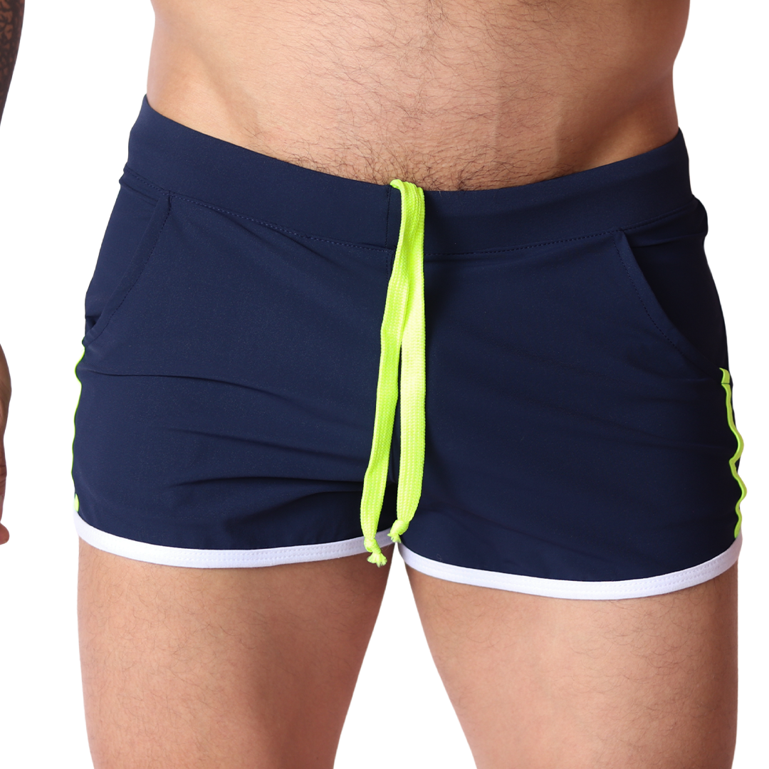 Front view of Gigo Typerhot navy blue athletic shorts with neon green drawstring and white hem trim.
