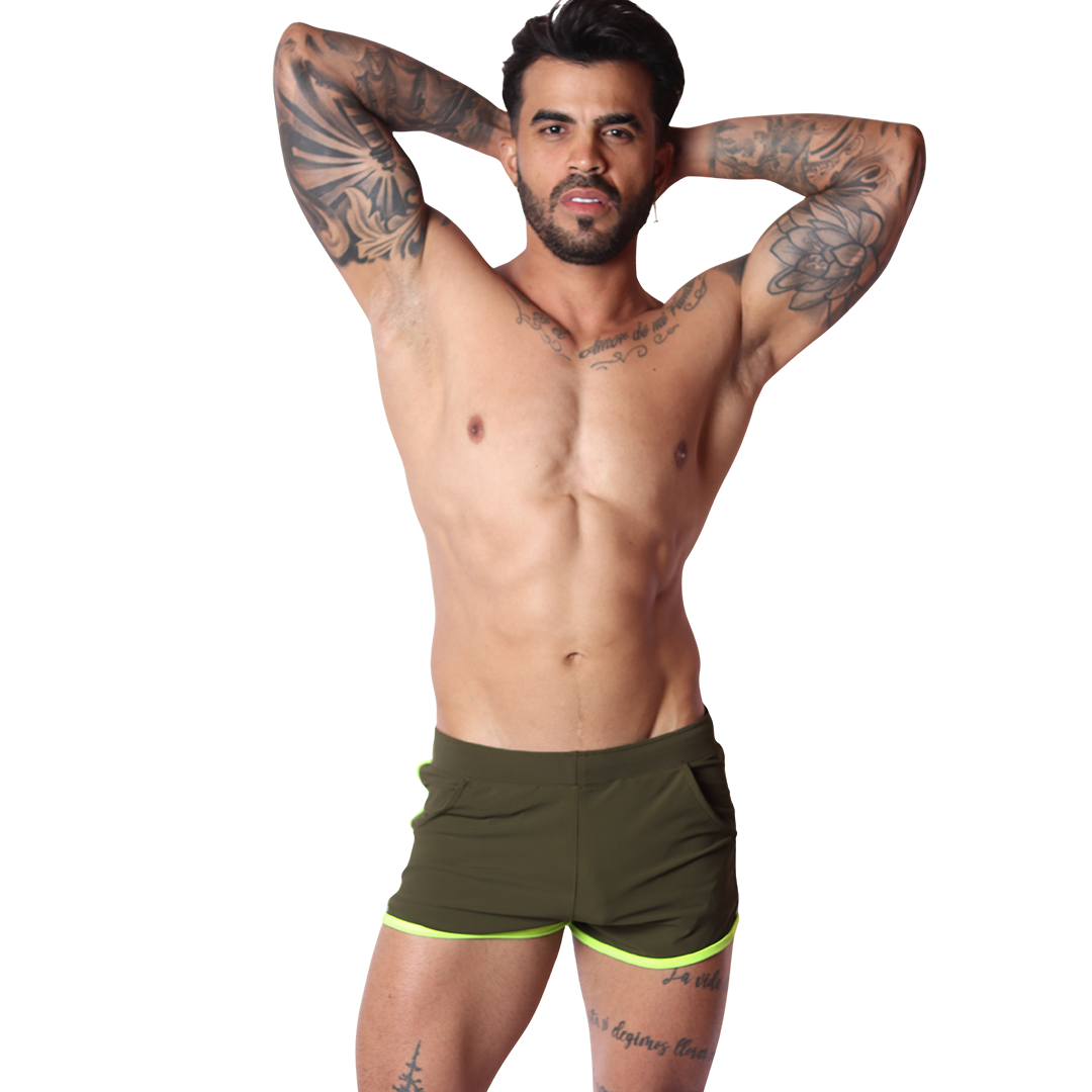 Front view of Gigo Typerhot green athletic fabric shorts with neon yellow trim on a muscular tattooed model.