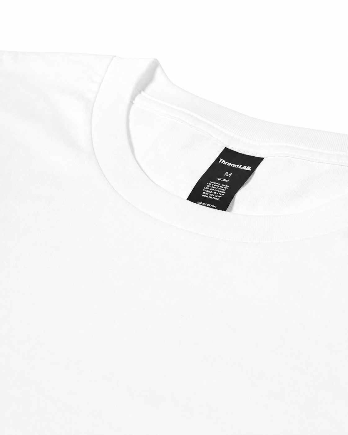 Close-up of a plain white crewneck t-shirt with a black ThreadLAB brand tag visible at the inner neckline.