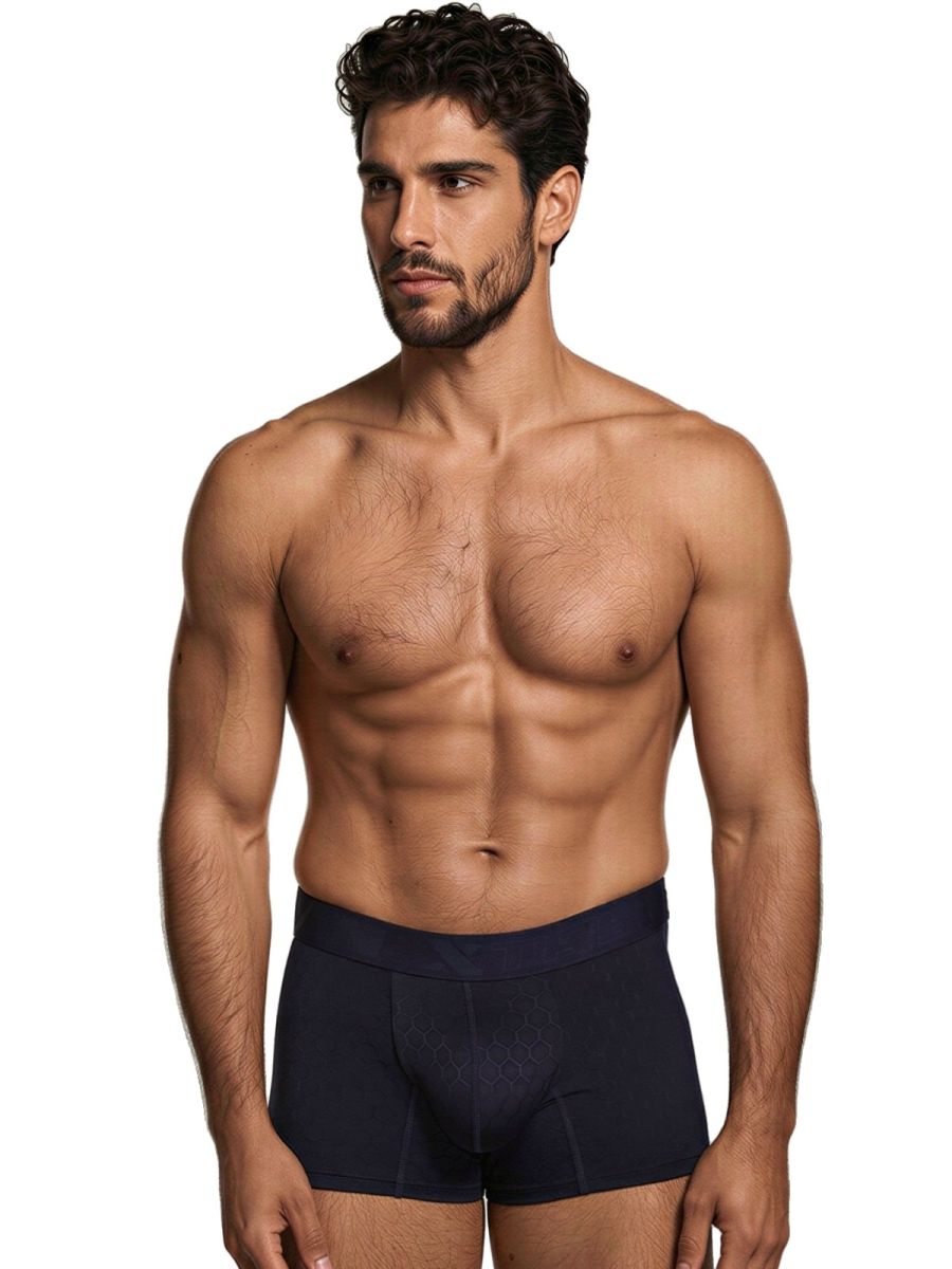 Xtremen navy blue trunk with honeycomb textured pouch detail. Model showing comfortable, fitted fabric.