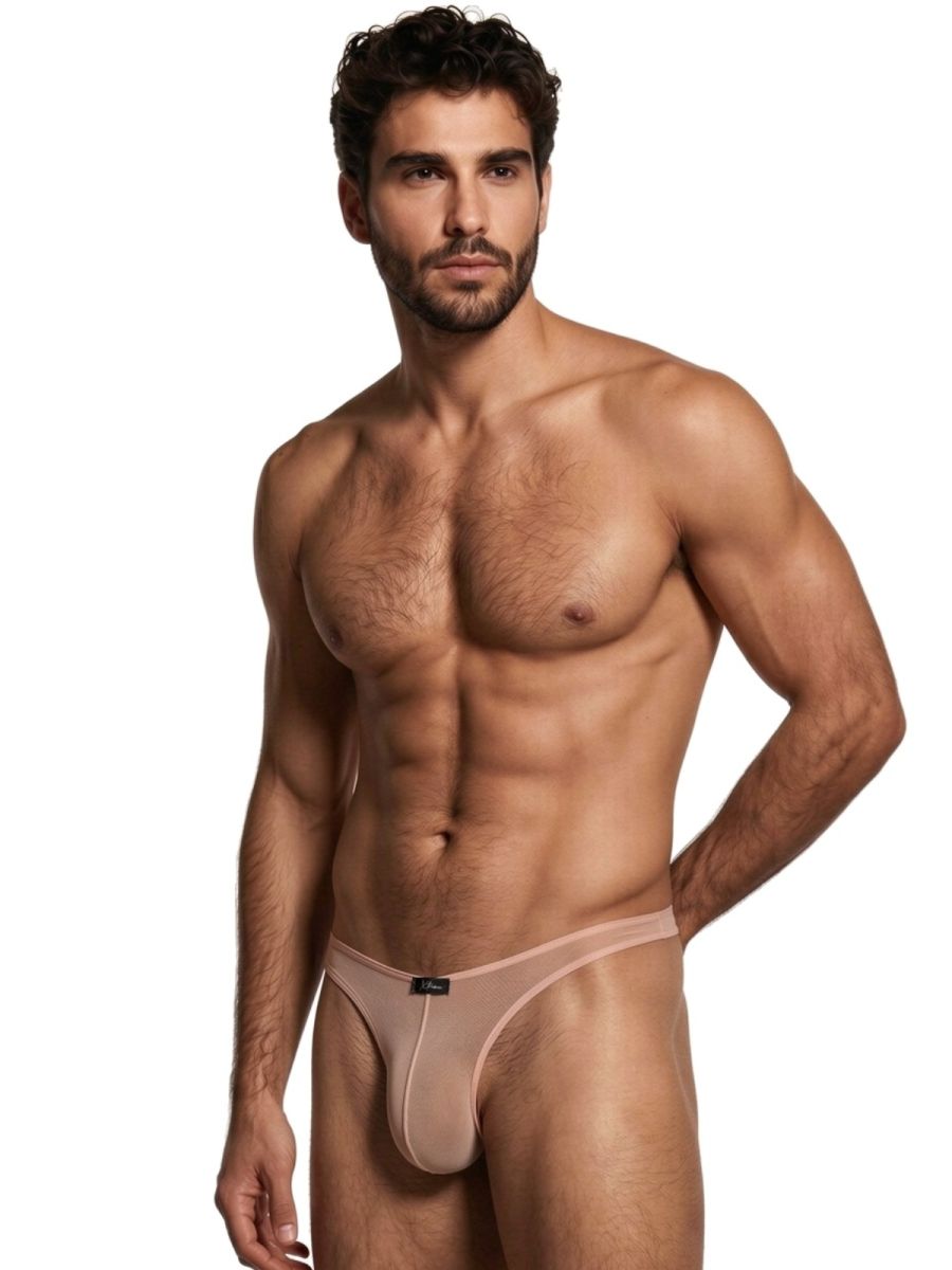 Xtremen beige sheer mesh bikini brief. Model features minimal coverage and thin waistband.