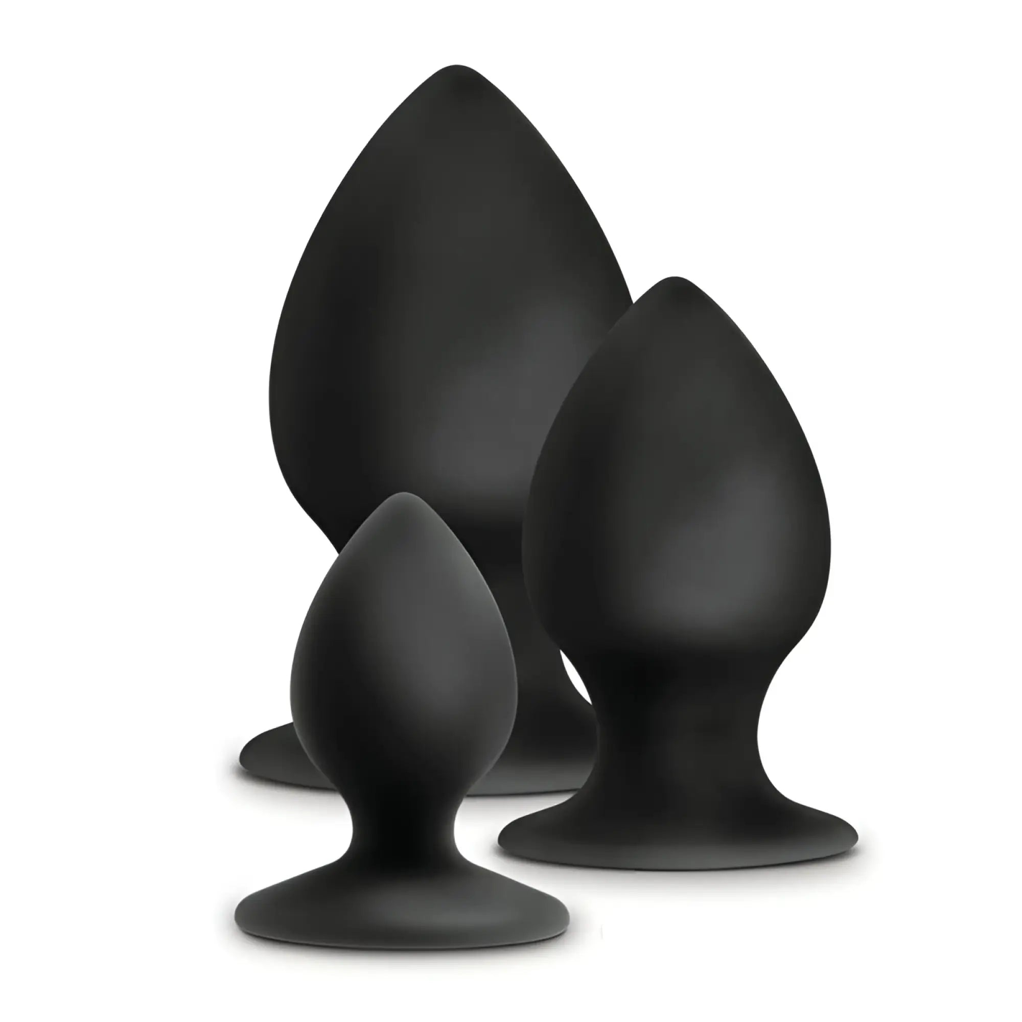 Set of three black silicone anal stout plugs in varying sizes with smooth teardrop shapes and rounded bases from Anal Adventures