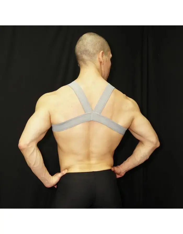 Grey body chest harness with wide straps worn by a model from Arroyman showcasing a muscular back.