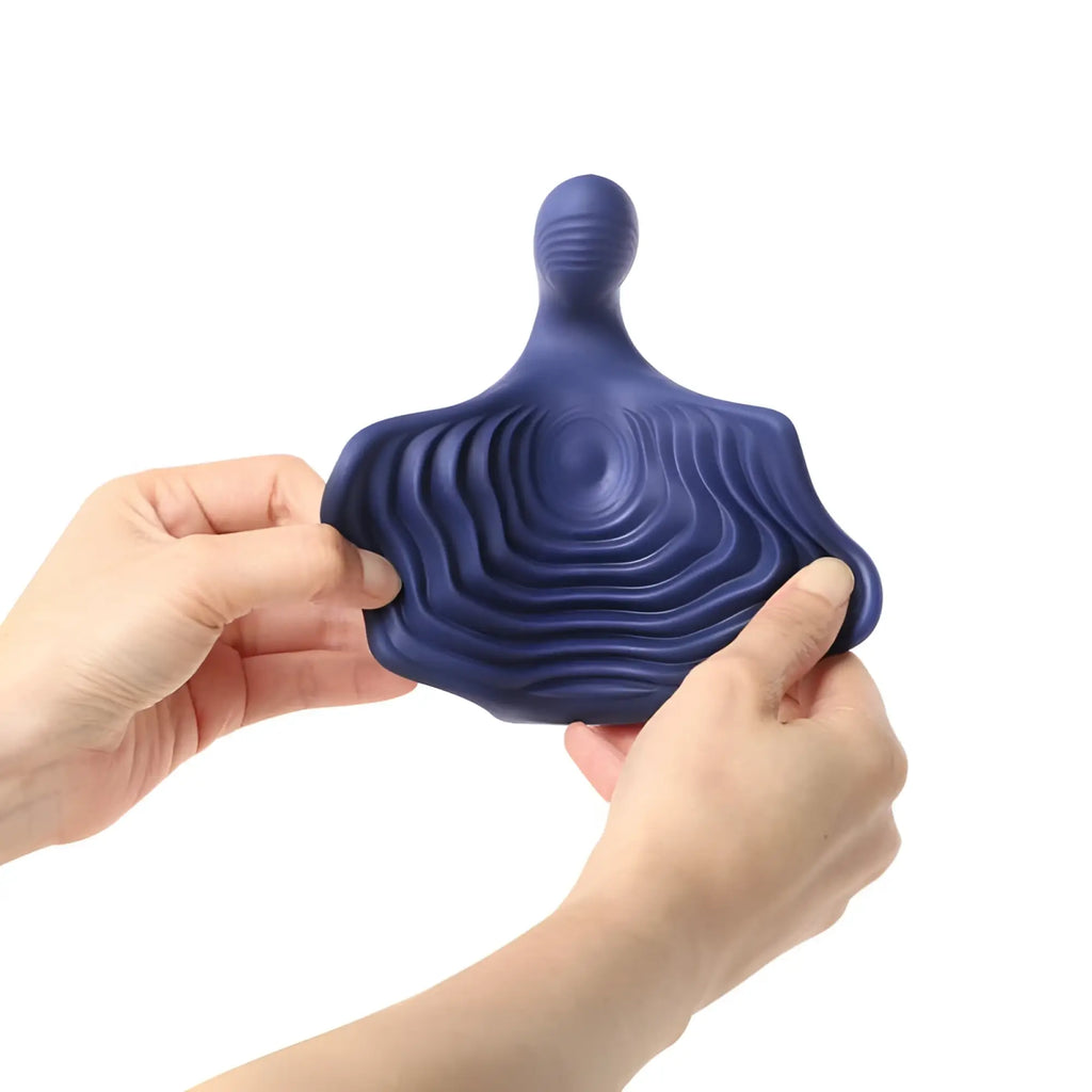 Deep blue ergonomic stress-relief fidget toy with concentric ridges shaped like a human figure for pulsatex stimulator