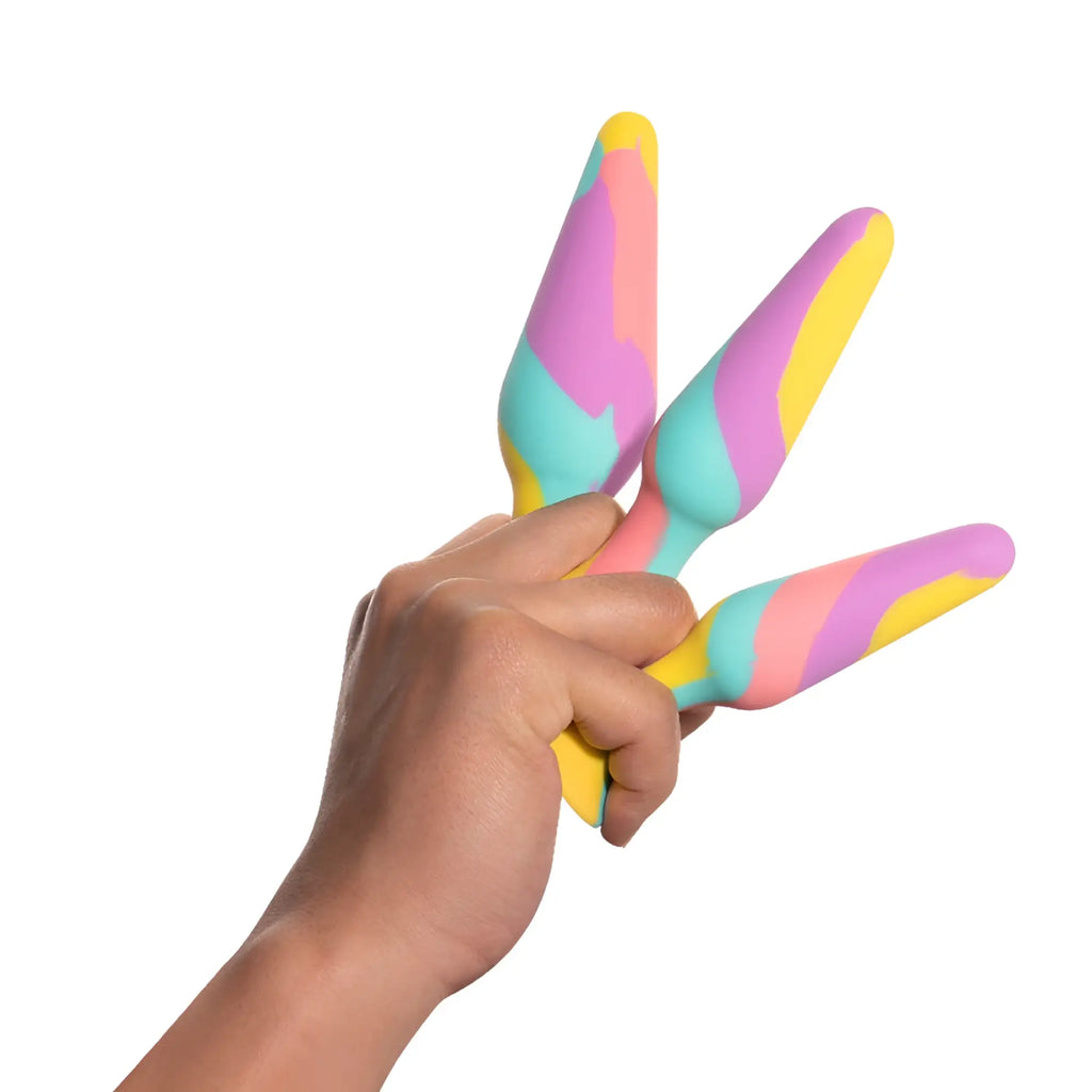Pastel rainbow-colored silicone ice cream scoop set shown with arosum triplugs 3 pc silicone anal training kit features