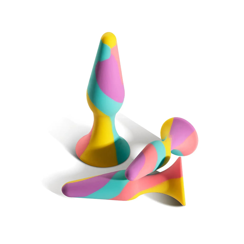 Arosum tripulgs 3 pc silicone anal training kit featuring vibrant rainbow-colored butt plugs with playful swirl patterns